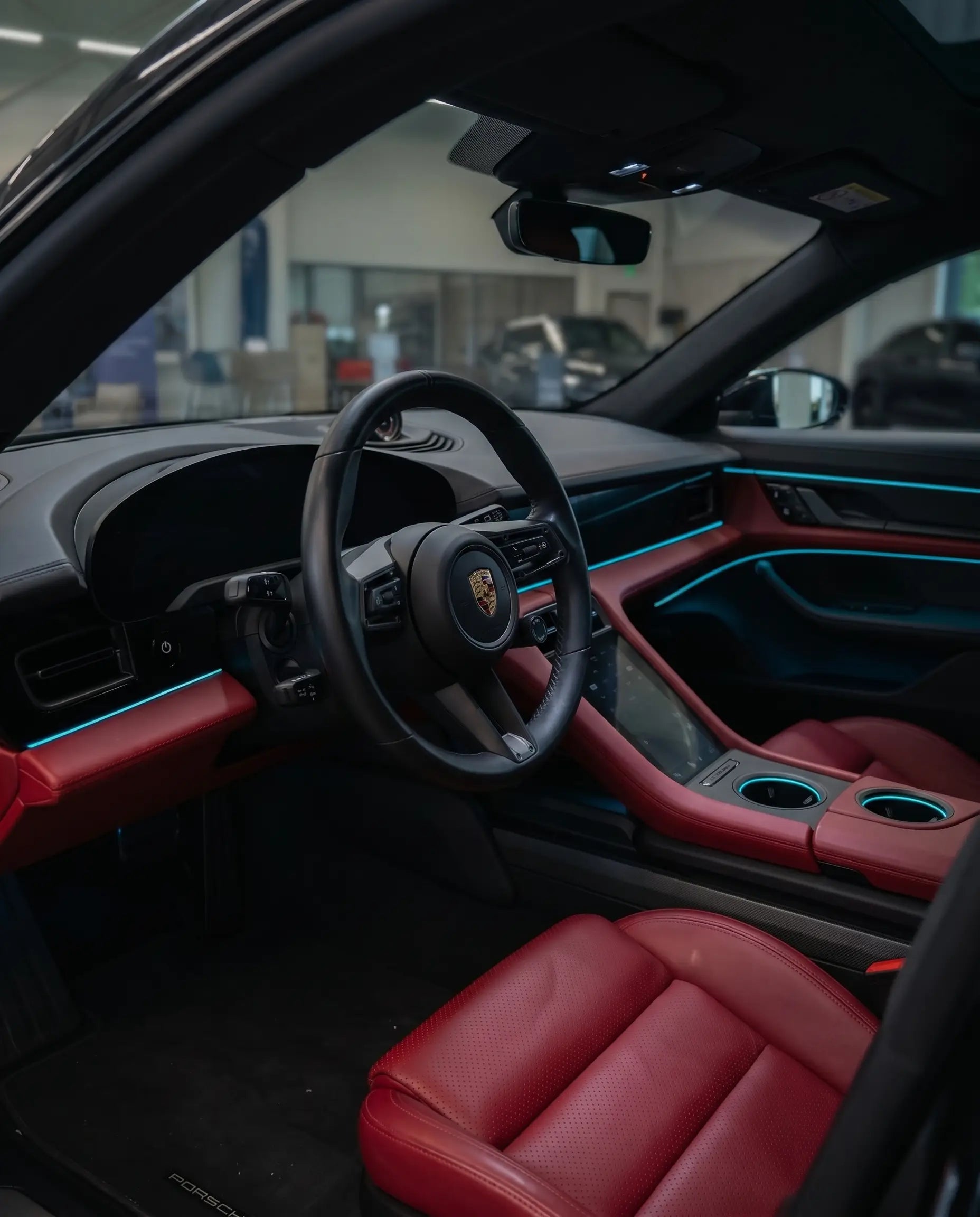 VYNTRA fiber optic ambient light glowing cyan blue in a premium car interior at night